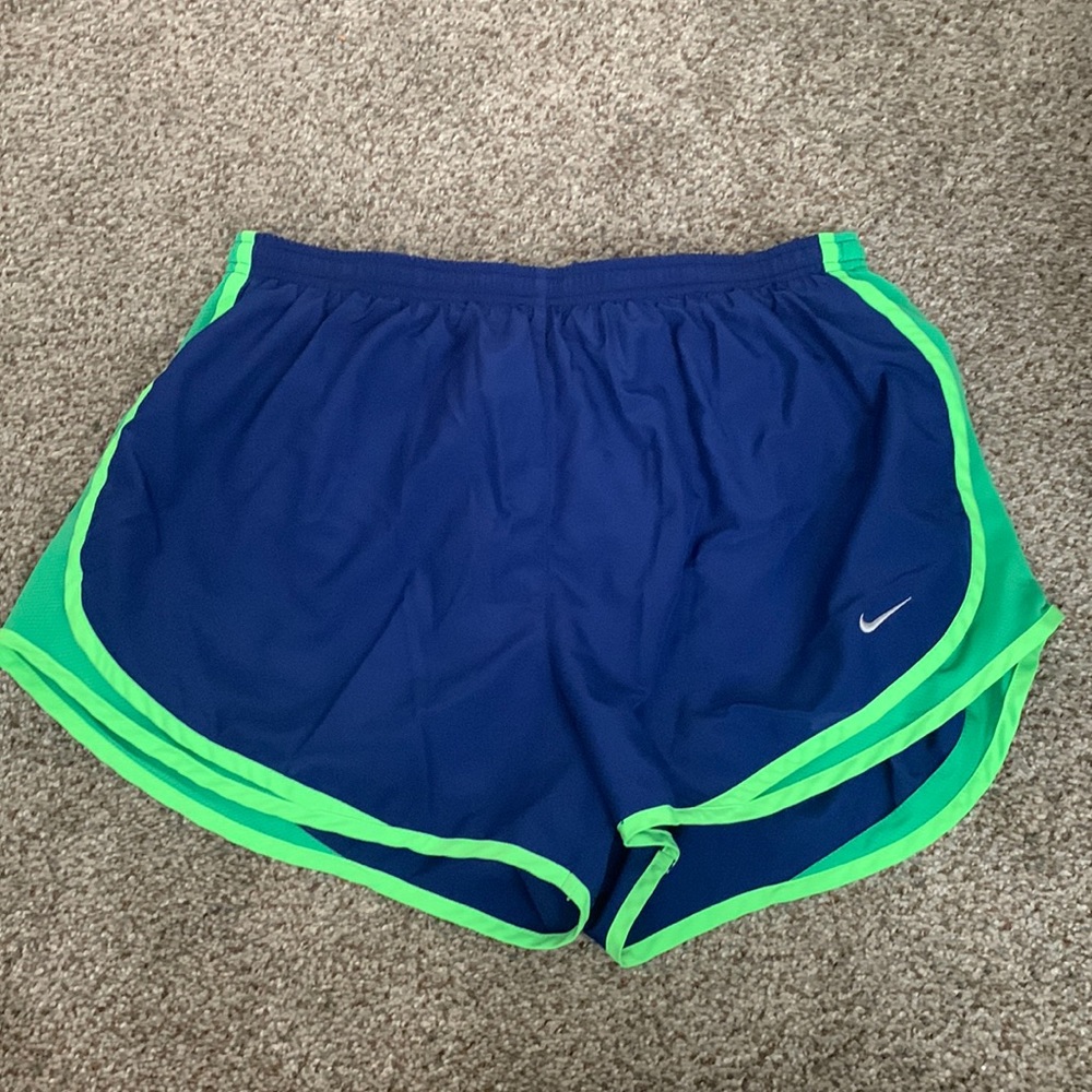 Blue Nike running shorts